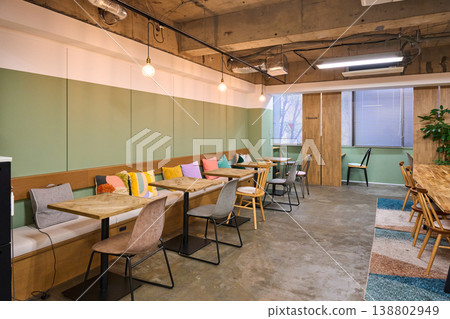 A stylish office break area lined with colorful cushions. A stylish office break area lined with colorful cushions. 138802949