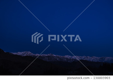 Snowy mountains at dawn Snowy mountains at dawn 138803903