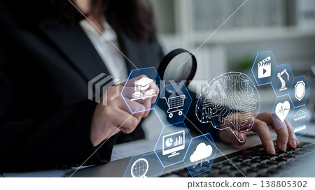Business professional examining digital icons with a magnifying glass, showcasing technology, analytics, education, and innovation concepts for modern enterprise solutions Quark Business professional examining digital icons with a magnifying glass, showcasing technology, analytics, education, and innovation concepts for modern enterprise solutions Quark 138805302