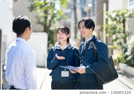 Staff members conversing with management Staff members conversing with management 138805320