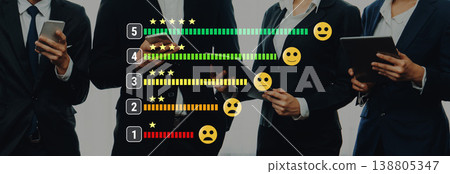 Group of Professionals Reviewing Feedback with Rating Stars and Emojis for Client Satisfaction in Modern Business Environment Trope 138805347