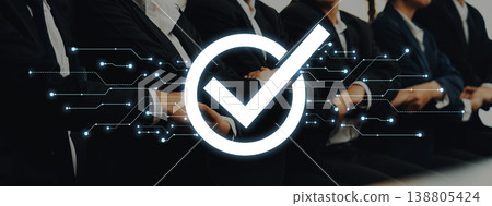 Business professionals in suits with digital checkmark icon, symbolizing approval, validation, teamwork, and modern technology in a corporate setting Trope Business professionals in suits with digital checkmark icon, symbolizing approval, validation, teamwork, and modern technology in a corporate setting Trope 138805424