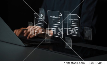 Digital Interaction with Floating Documents Displaying Terms and Conditions Above a Laptop in a Modern Workspace Gluon Digital Interaction with Floating Documents Displaying Terms and Conditions Above a Laptop in a Modern Workspace Gluon 138805849