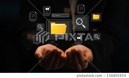 Hands Holding Digital Interface with Yellow Folder and Search Icons Representing Organized Data Management and Project Planning Concepts Gluon Hands Holding Digital Interface with Yellow Folder and Search Icons Representing Organized Data Management and Project Planning Concepts Gluon 138805854