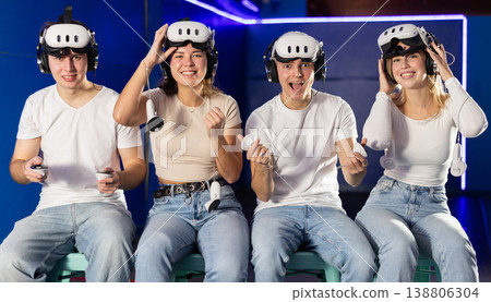 Stunned by exciting game, group of friends lowered helmet and took break from game. Stunned by exciting game, group of friends lowered helmet and took break from game. 138806304