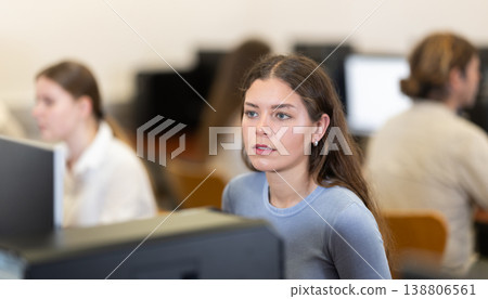 Portrait of female student studying in university computer class Portrait of female student studying in university computer class 138806561