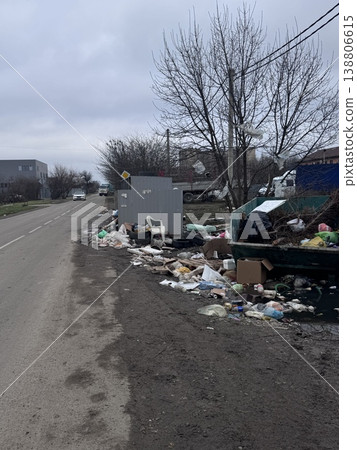 Russia, Krasnodar - July 11, 2025: Illegal roadside dumping with garbage pile in suburban area on a cloudy day 138806615