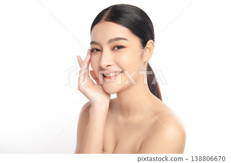 A beautiful young Asian woman with clean, fresh skin against a white background. Skincare, facial treatment, cosmetology, beauty, and spa. An elegant portrait of an Asian woman. 138806670