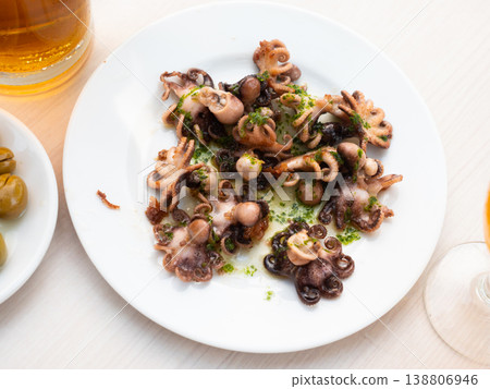 Ready to serve baby octopus with greens Ready to serve baby octopus with greens 138806946