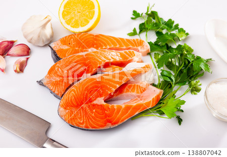 Raw salmon steaks, over white background 138807042