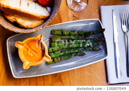 Asparagus dish with Romesco sauce 138807049