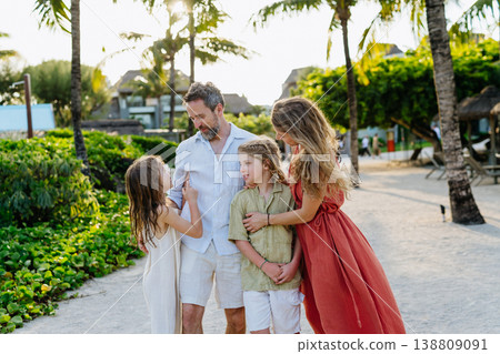 Family enjoying tropical beach vacation at luxury resort. Family enjoying tropical beach vacation at luxury resort. 138809091