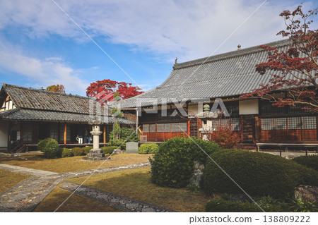 Nov 24 2025 Zen temple main hall framed by seasonal garden windows Nov 24 2025 Zen temple main hall framed by seasonal garden windows 138809222