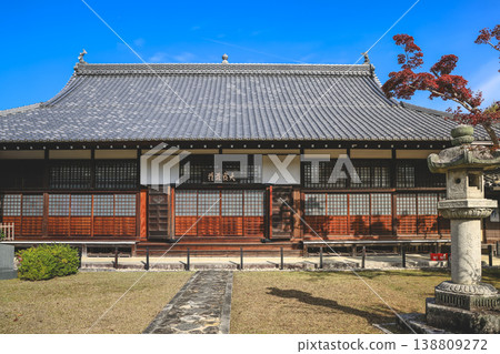 Nov 24 2025 Zen temple main hall framed by seasonal garden windows Nov 24 2025 Zen temple main hall framed by seasonal garden windows 138809272