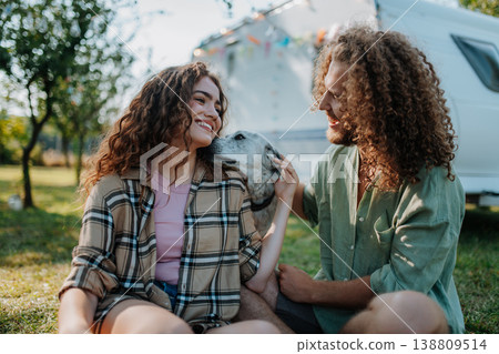 Young couple is on a camping trip in nature. Caravan traveling for young people. Young couple is on a camping trip in nature. Caravan traveling for young people. 138809514