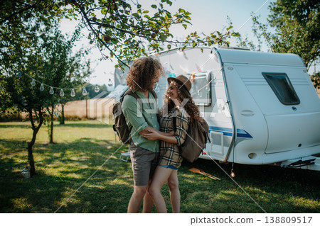 Young couple is on a camping trip in nature. Budget friendly caravan travel. 138809517