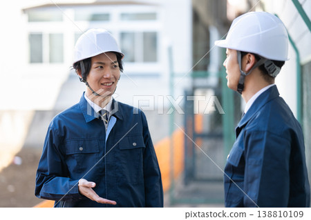 Engineers having a conversation Engineers having a conversation 138810109