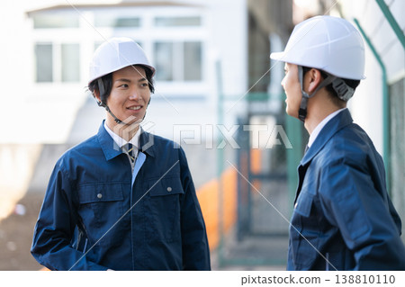 Engineers having a conversation Engineers having a conversation 138810110