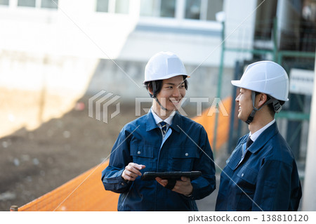 Engineers having a conversation Engineers having a conversation 138810120