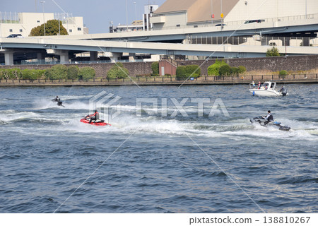 A group of jet skis going up the Sumida River A group of jet skis going up the Sumida River 138810267