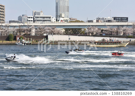 A group of jet skis going up the Sumida River 138810269