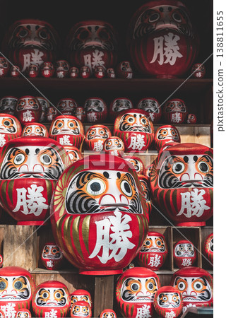 A group of Daruma dolls donated to Katsuoji Temple in Minoo, considered lucky charms that bring victory and good fortune. A group of Daruma dolls donated to Katsuoji Temple in Minoo, considered lucky charms that bring victory and good fortune. 138811655