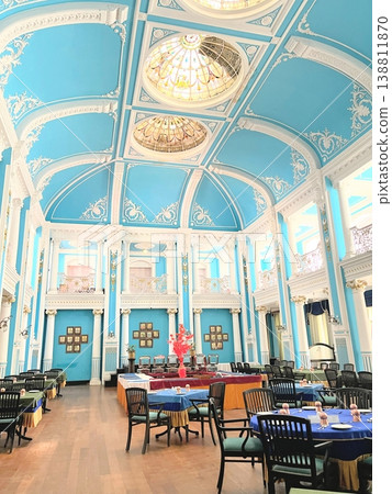 The luxurious dining hall of Lalita Mahal Palace, beautifully decorated in white and light blue. The luxurious dining hall of Lalita Mahal Palace, beautifully decorated in white and light blue. 138811870
