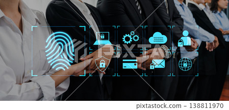 Business professionals collaborating on data security with digital icons and fingerprint scan technology in a modern office environment Trope 138811970