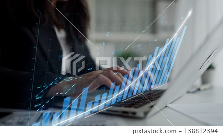 Professional businesswoman analyzing financial data with advanced analytics technology on laptop computer in modern workspace Copula Professional businesswoman analyzing financial data with advanced analytics technology on laptop computer in modern workspace Copula 138812394
