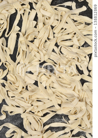 Raw Homemade Tagliatelle Pasta Texture Raw Homemade Tagliatelle Pasta Texture 138812869
