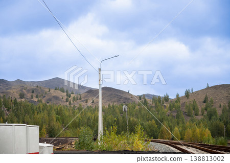 railroad, lantern and mountains. Eco-restoration and reclamation of industrial areas for improved environmental conditions and quality of life. railroad, lantern and mountains. Eco-restoration and reclamation of industrial areas for improved environmental conditions and quality of life. 138813002
