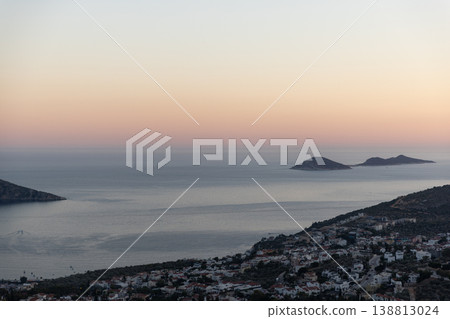 Golden sunset light bathes a rocky coastline. Kalkan, Turkey Golden sunset light bathes a rocky coastline. Kalkan, Turkey 138813024