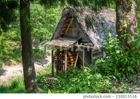 Traditional watermill surrounded by nature in Shirakawa-go, Japan 138813516