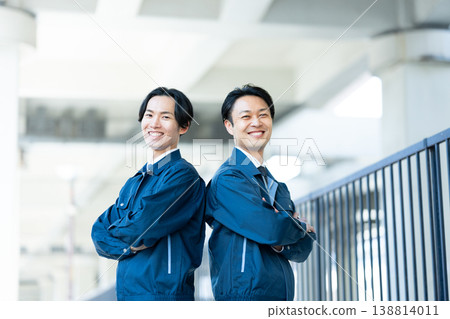 A smiling engineer with his arms crossed. A smiling engineer with his arms crossed. 138814011