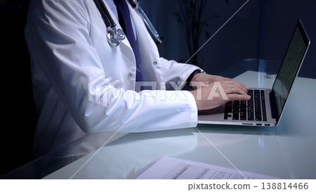 Medical doctor in lab coat with stethoscope typing on laptop in a dim office, managing electronic health records and telemedicine data for modern digital healthcare workflows Medical doctor in lab coat with stethoscope typing on laptop in a dim office, managing electronic health records and telemedicine data for modern digital healthcare workflows 138814466