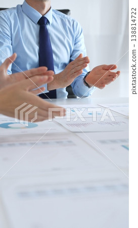 Applauses for the winners. Diverse business people clapping hands in meeting celebrating success with financial charts. Teamwork achievements concept Applauses for the winners. Diverse business people clapping hands in meeting celebrating success with financial charts. Teamwork achievements concept 138814722