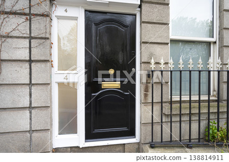 the black colored entrance door to a building in Dublin, Ireland 138814911