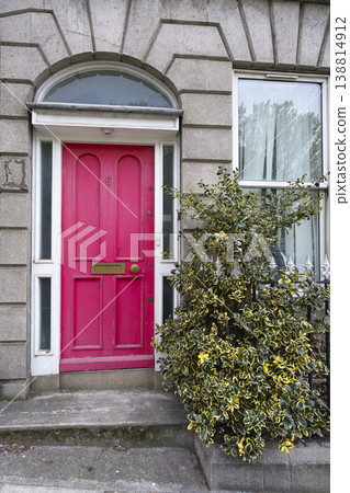 the pink colored entrance door to a building in Dublin, Ireland the pink colored entrance door to a building in Dublin, Ireland 138814912