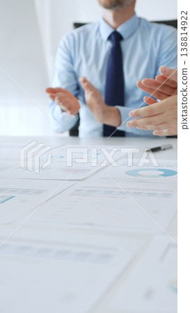 Diverse business people clapping hands in meeting celebrating success with financial charts, performance reports, teamwork, company growth, and management achievement Diverse business people clapping hands in meeting celebrating success with financial charts, performance reports, teamwork, company growth, and management achievement 138814922