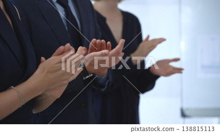 Business audience hands clapping, showing appreciation and success in a corporate meeting, celebrating achievement and positive feedback at a professional event Business audience hands clapping, showing appreciation and success in a corporate meeting, celebrating achievement and positive feedback at a professional event 138815113