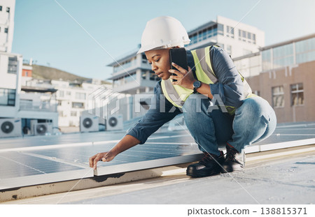 Black woman, rooftop solar panel or maintenance phone call about photovoltaic plate, sustainability or project. Eco friendly energy, cellphone conversation or female engineer talking about inspection Black woman, rooftop solar panel or maintenance phone call about photovoltaic plate, sustainability or project. Eco friendly energy, cellphone conversation or female engineer talking about inspection 138815371