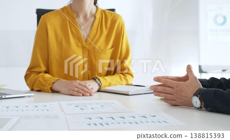 Business professionals discussing financial charts, collaborating on data analysis and strategic planning in contemporary workplace setting with graphs and reports Business professionals discussing financial charts, collaborating on data analysis and strategic planning in contemporary workplace setting with graphs and reports 138815393