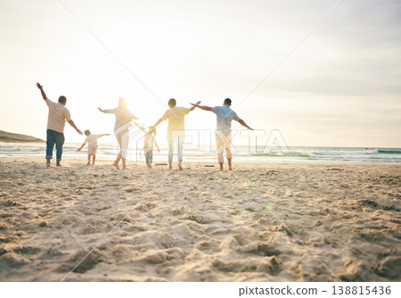 Family, generations and back view on the beach, travel and tropical vacation with freedom and sunshine. People outdoor, grandparents and parents with young kids, adventure and happiness in nature Family, generations and back view on the beach, travel and tropical vacation with freedom and sunshine. People outdoor, grandparents and parents with young kids, adventure and happiness in nature 138815436