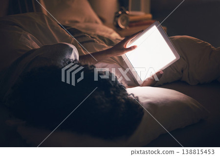 Woman, tablet and bed in night with blank blank, reading and typing for contact, chat or social media app. Girl, digital touchscreen and mockup space with empty ux, scroll or watch video in dark home 138815453