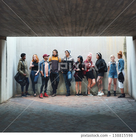 People, student and friends in relax or social gather standing against a wall in urban town. Diversity or group of creative teenagers hanging out together on college campus with mockup space outside 138815598