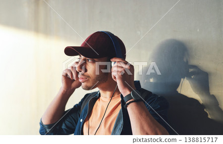 Man, student with headphones and music on campus, future mindset and audio against wall background. Gen z, education and male person thinking while at college, tech with radio and podcast streaming Man, student with headphones and music on campus, future mindset and audio against wall background. Gen z, education and male person thinking while at college, tech with radio and podcast streaming 138815717