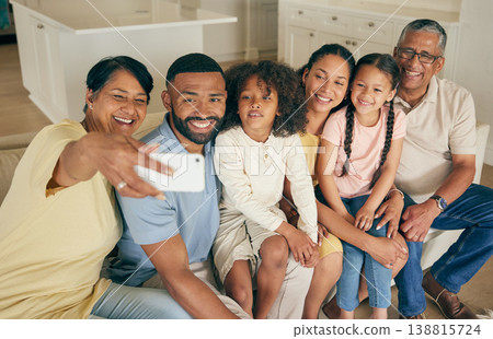 Family selfie, grandparents and kids on sofa with social media or online memory for bond, love and happy home. Senior mom, dad and biracial children in living room for photography or profile picture 138815724