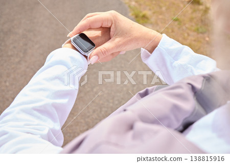 Runner hands, smart watch and road with check, progress and tech for fitness, heart or speed in summer. Woman, running and iot clock for stats, health and data for exercise, wellness or app on street 138815916