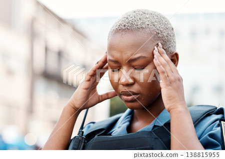 Black woman, police and headache in stress, anxiety or burnout in the city for justice or law enforcement. Tired female person or officer in pain, depression or overworked in street of an urban town Black woman, police and headache in stress, anxiety or burnout in the city for justice or law enforcement. Tired female person or officer in pain, depression or overworked in street of an urban town 138815955