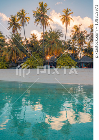 Breathtaking tropical island sunset palm trees calm ocean water serene summer beach paradise travel scenic nature background Breathtaking tropical island sunset palm trees calm ocean water serene summer beach paradise travel scenic nature background 138815973